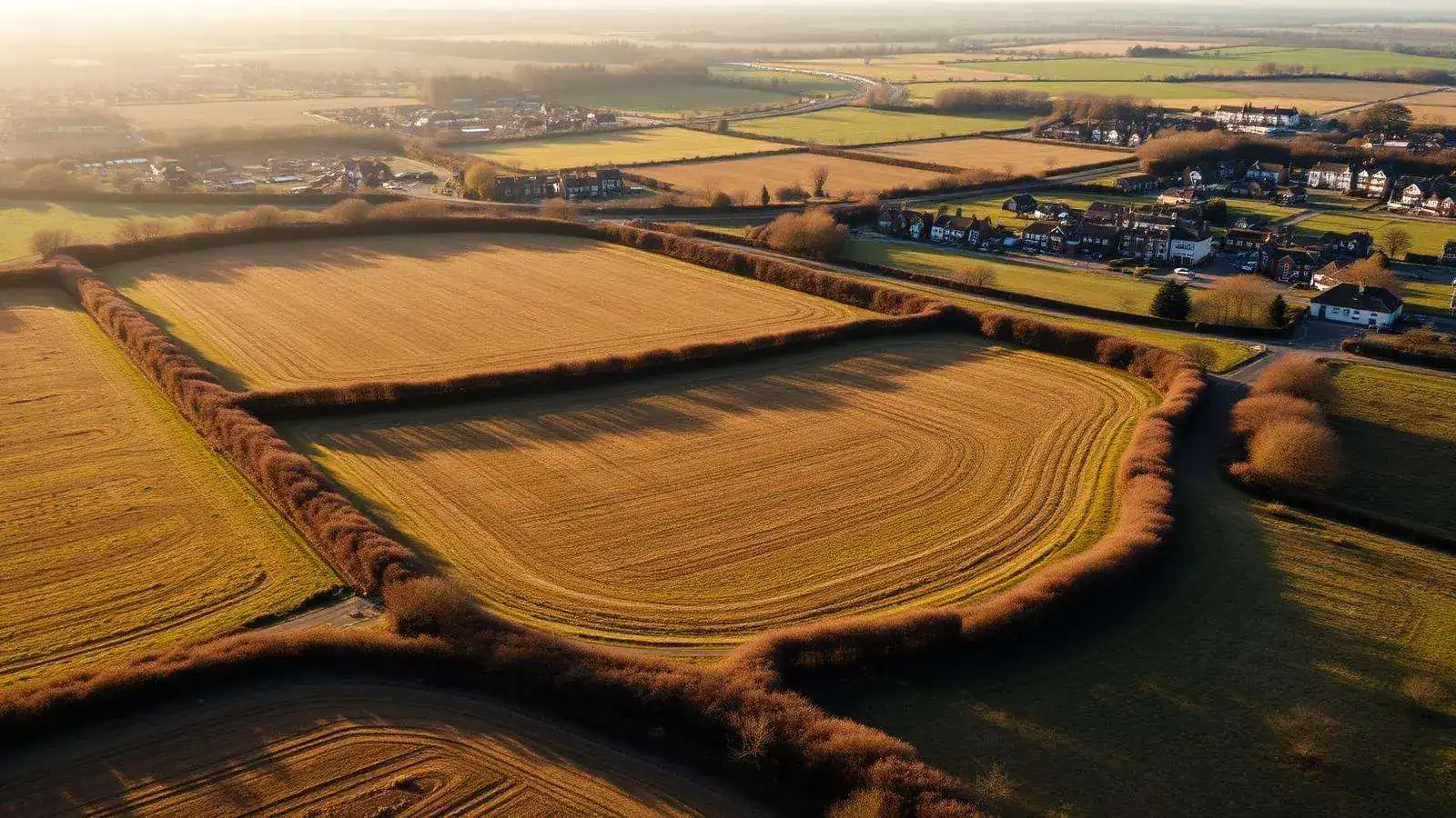 Aerial view of a rural development plot on the edge of an English market town